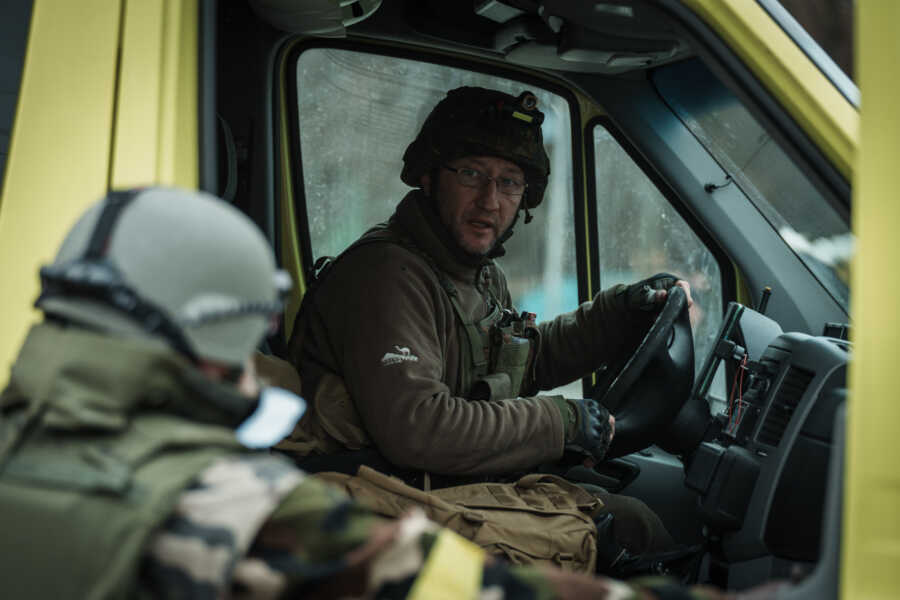 Ukrainian man drives evacuation bus.