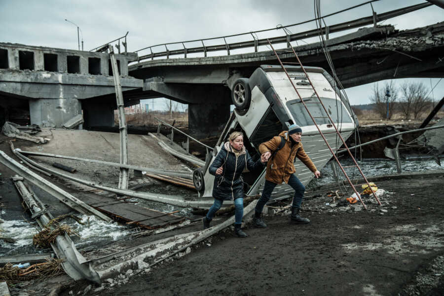 Couple flee through destruction of Ukraine.