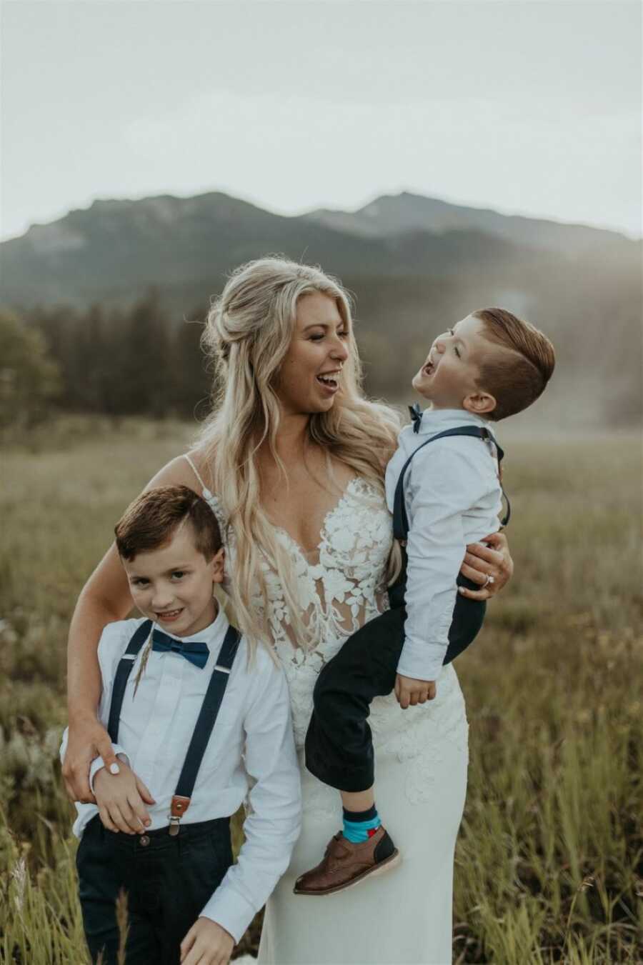 Stepmom takes candid photo with her two stepsons on her wedding day