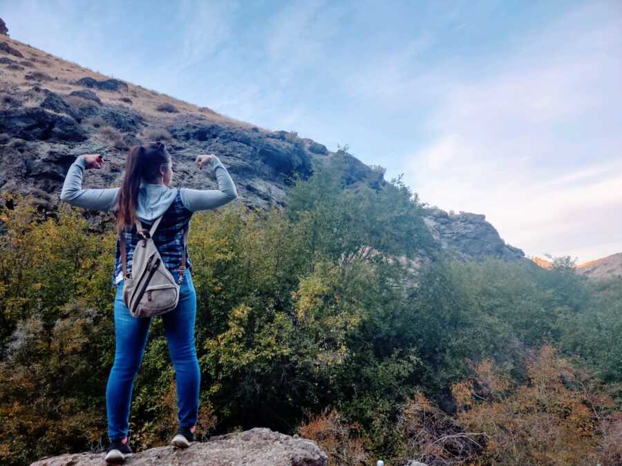 woman on hike happy and thriving