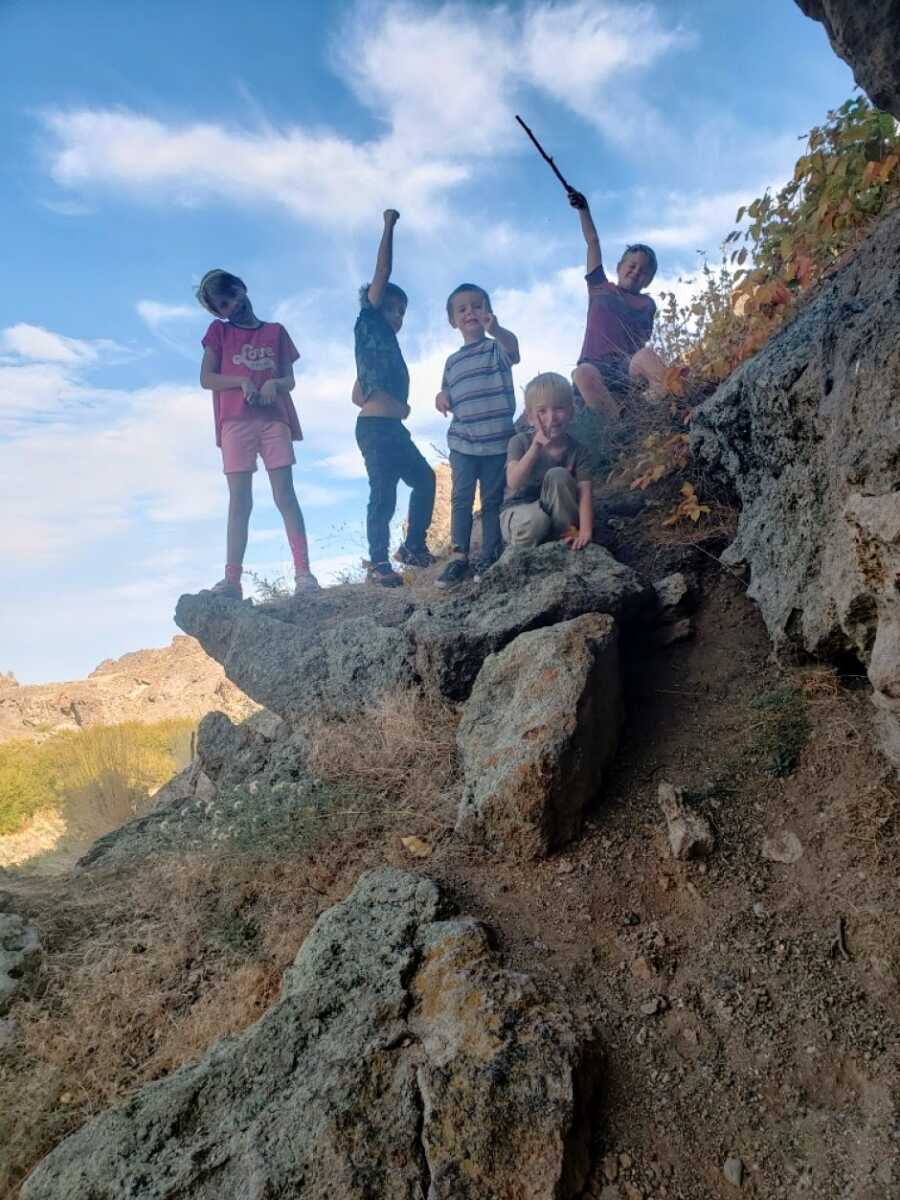 kids on a rock posing