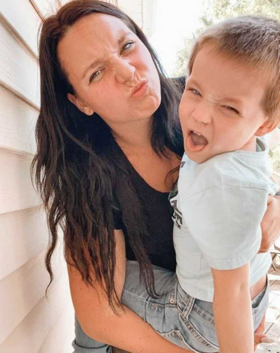 Mom and son take a silly selfie together
