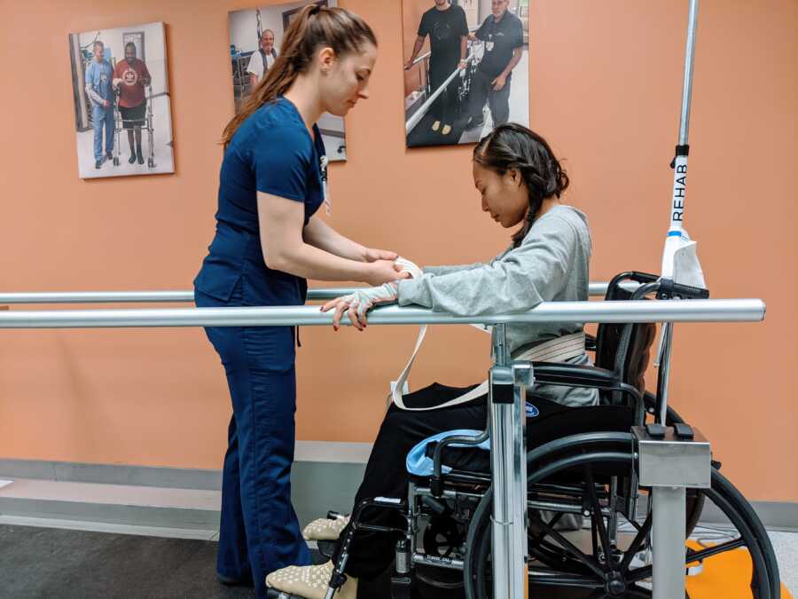 Woman paralyzed from Transverse Myelitis does physical therapy in a wheelchair