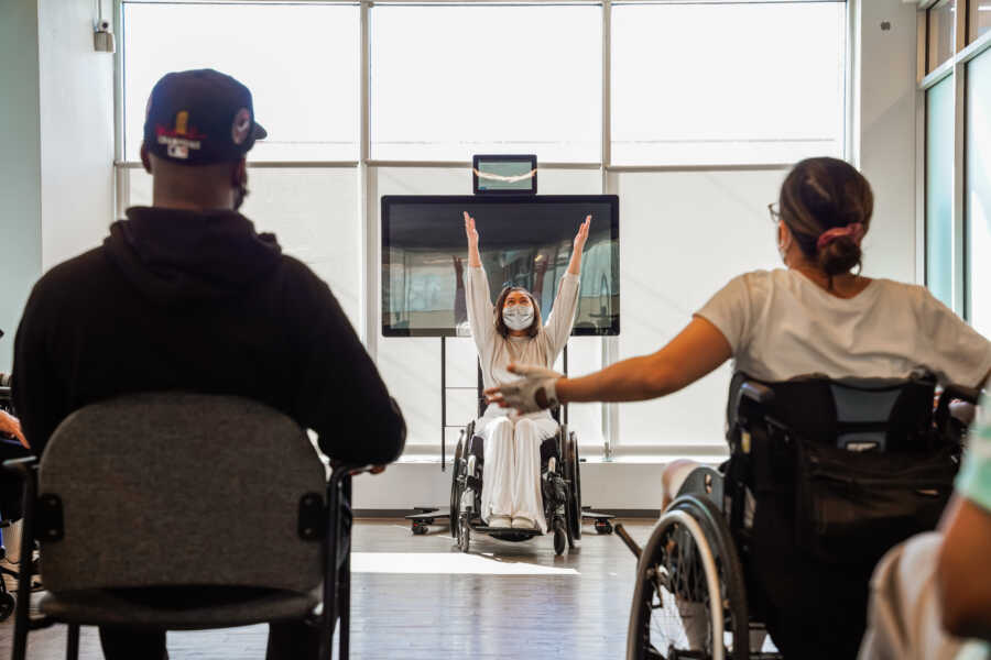 Woman leads chair yoga class after being paralyzed from Transverse Myelitis