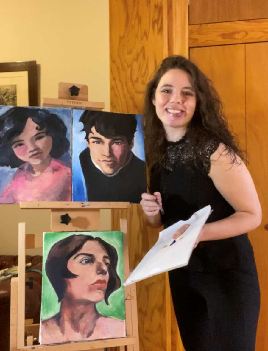 artist smiling with her painting