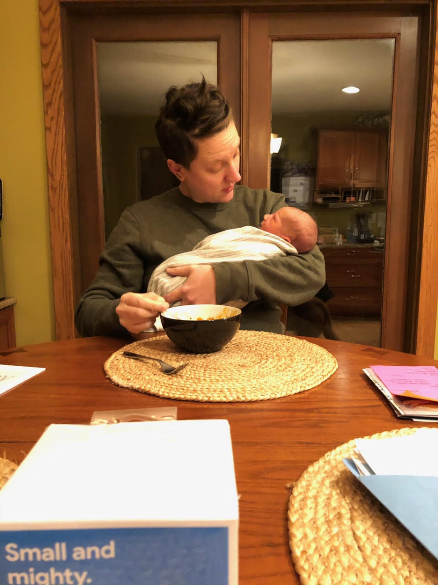 mom holding her son at the kitchen table