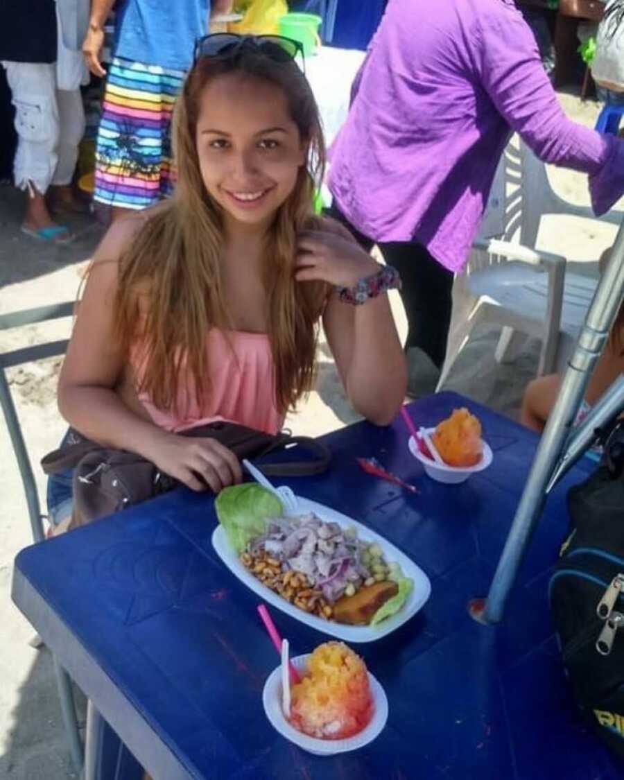 teen girl in peru eating the local food