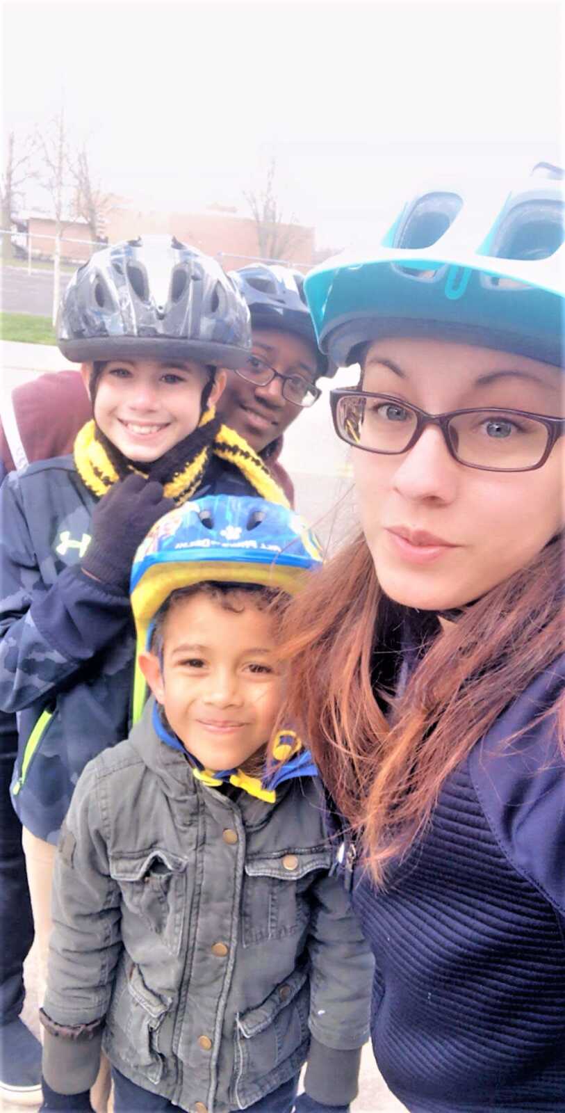 Two moms spend some bonding time outside with their sons