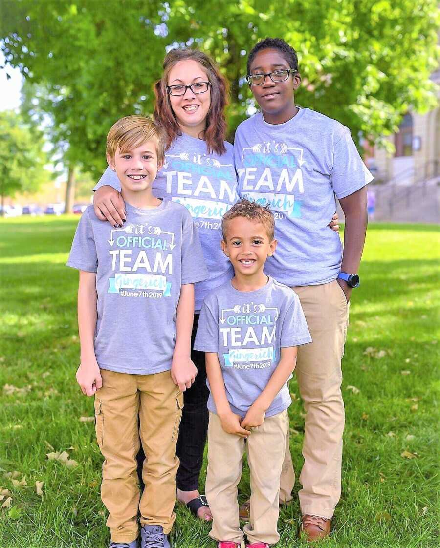 Family take photos together to celebrate intrafamily adoption in matching t-shirts