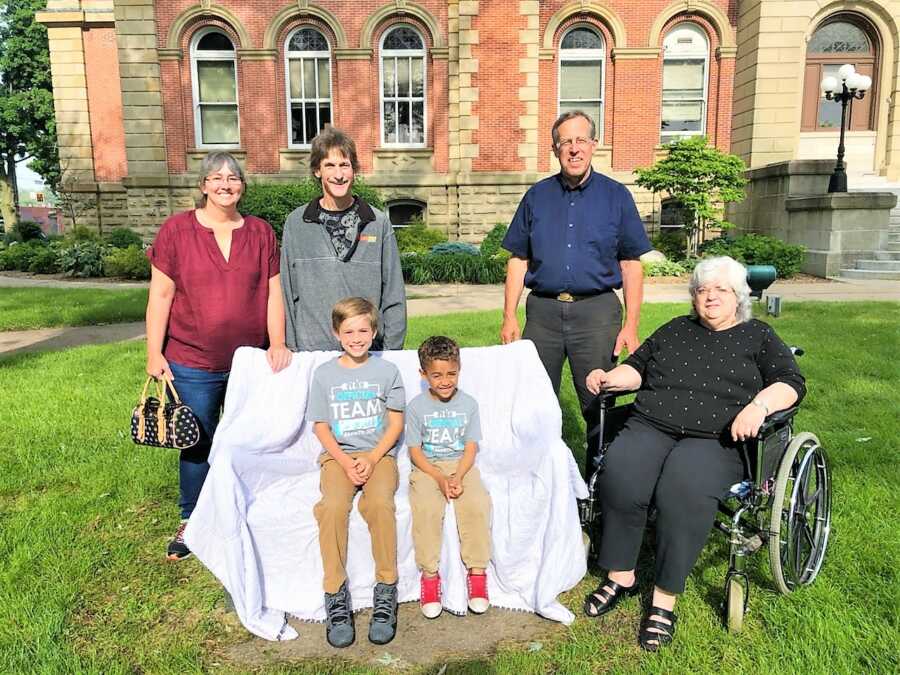 Family take photos together to celebrate their adoption 