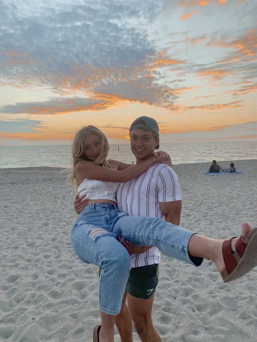 couple taking cute pictures at the beach