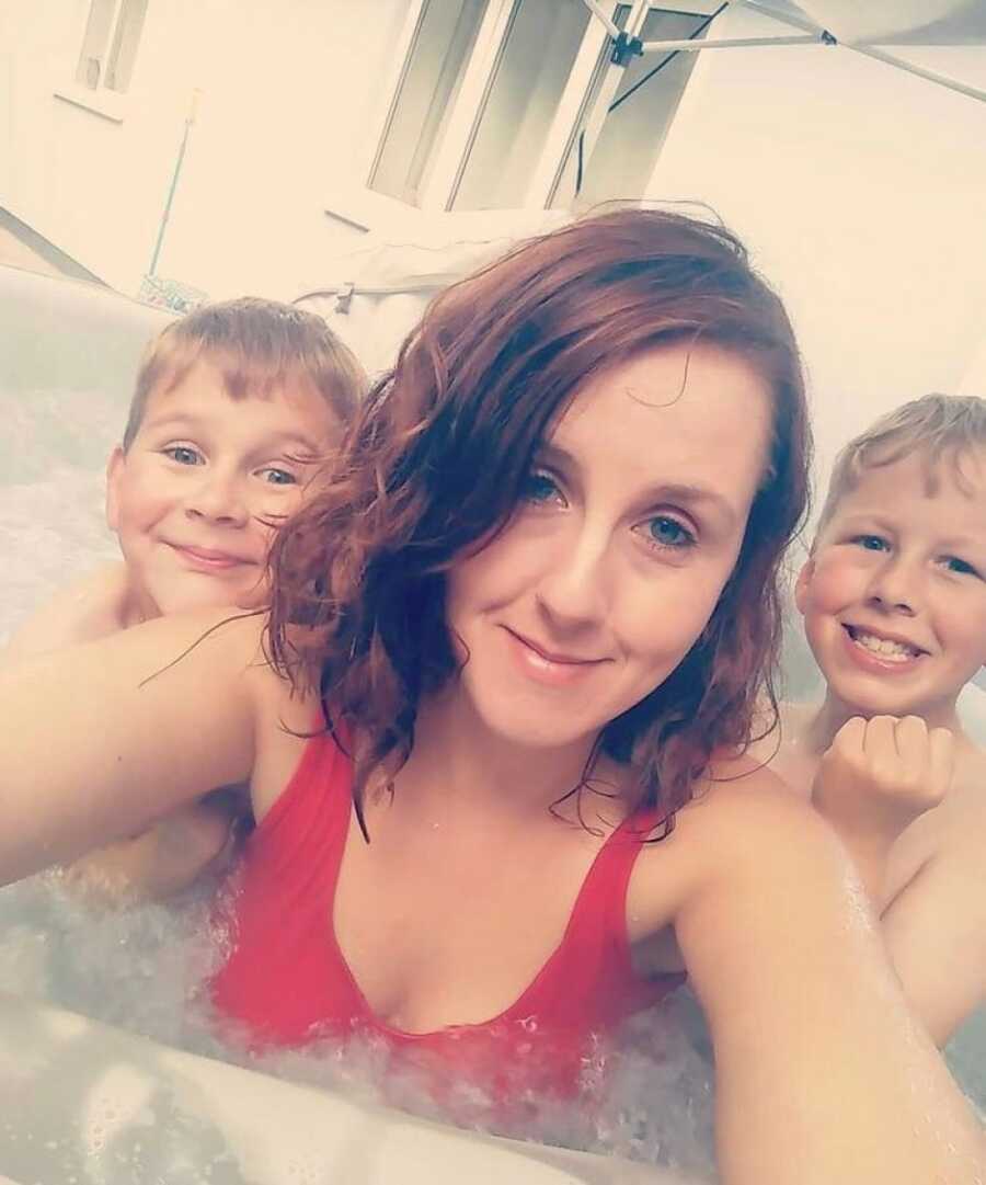 mom with sons in hot tub