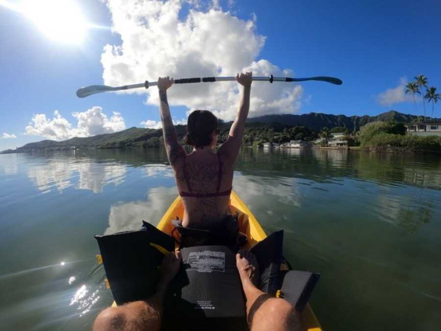 woman kyaking on a lake