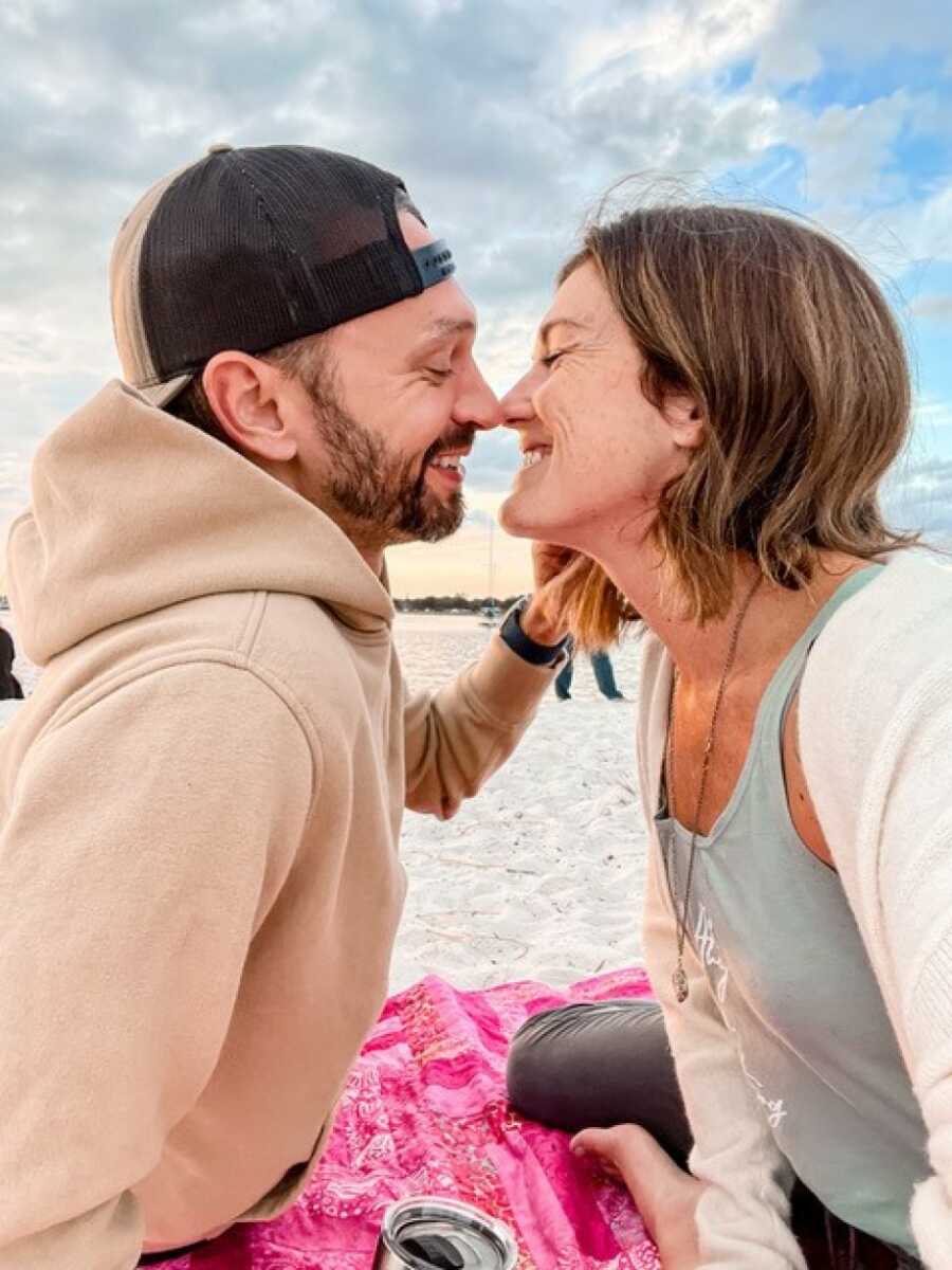 couple kissing on the beach