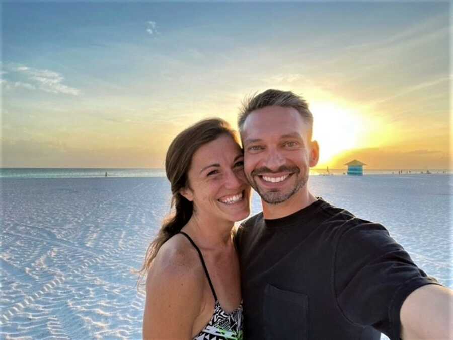 couple taking a selfie on the beach