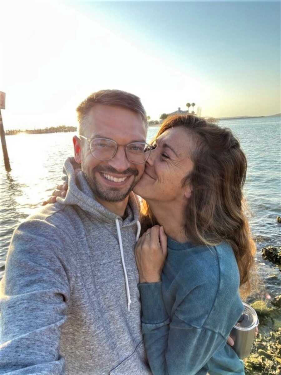 girlfriend kissing boyfriend on cheek