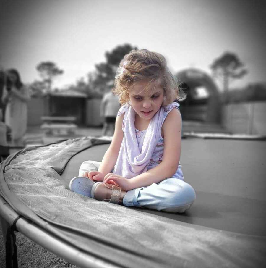 little girl on a trampoline