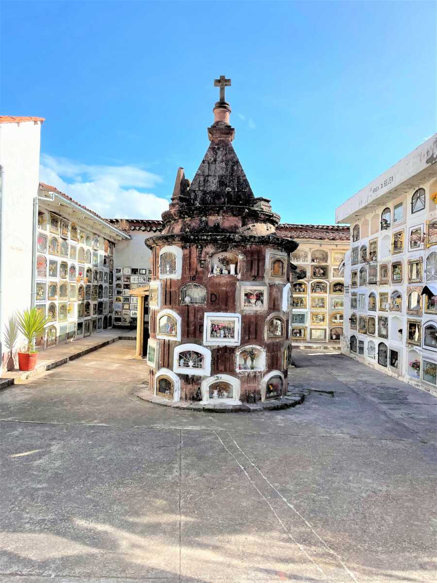 long-shot of a cemetery with a small tower in the middle 