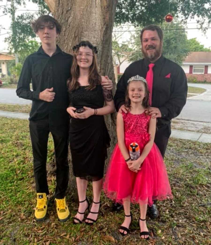 Siblings take a group photo before attending a dance