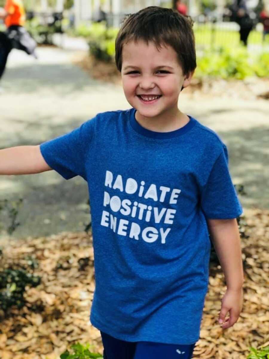 little boy in motivational shirt