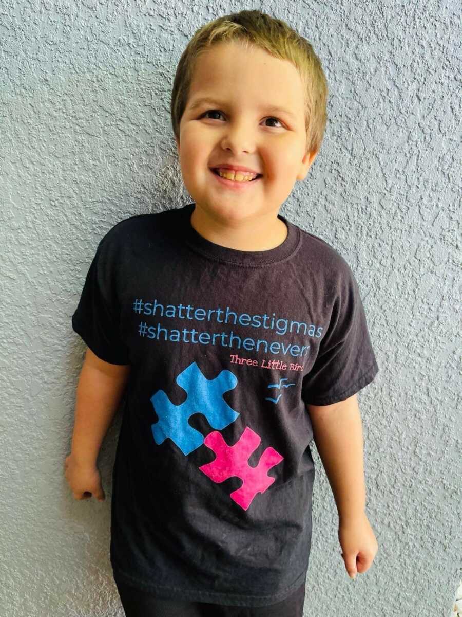 little boy in his autism awareness shirt