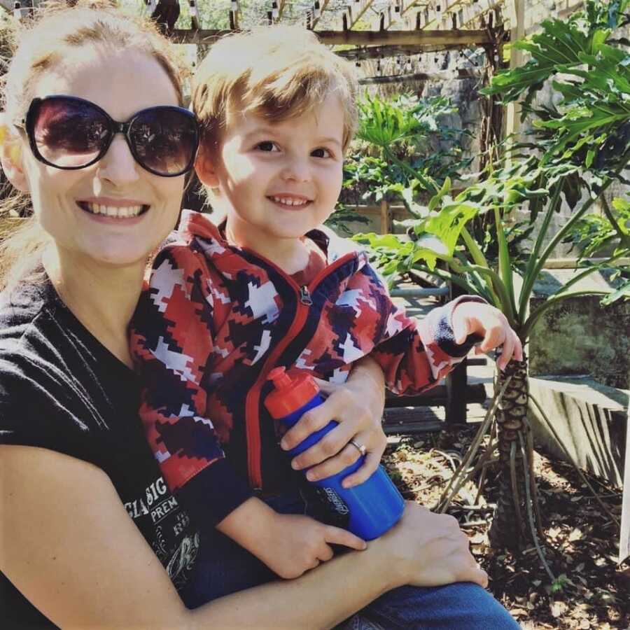 mom and baby boy in a garden