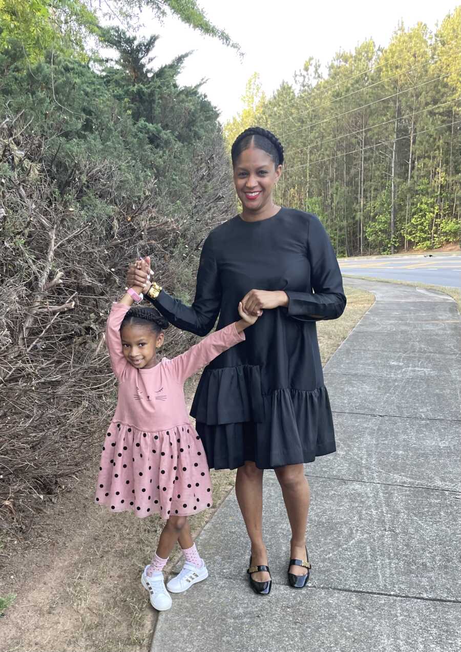 mom and daughter having fun in dresses