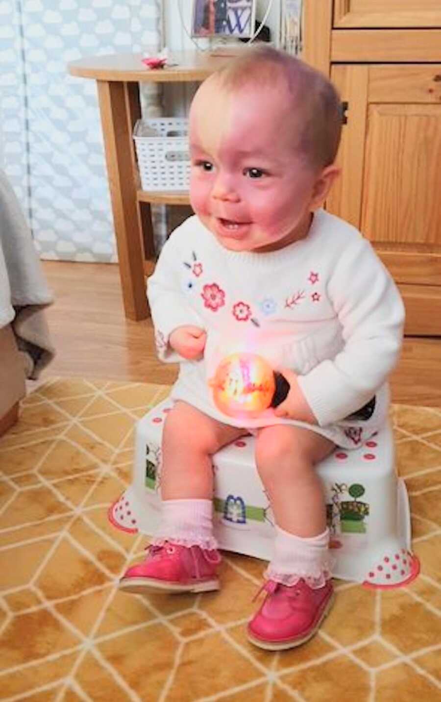 girl with sturge-weber syndrome wearing special boots