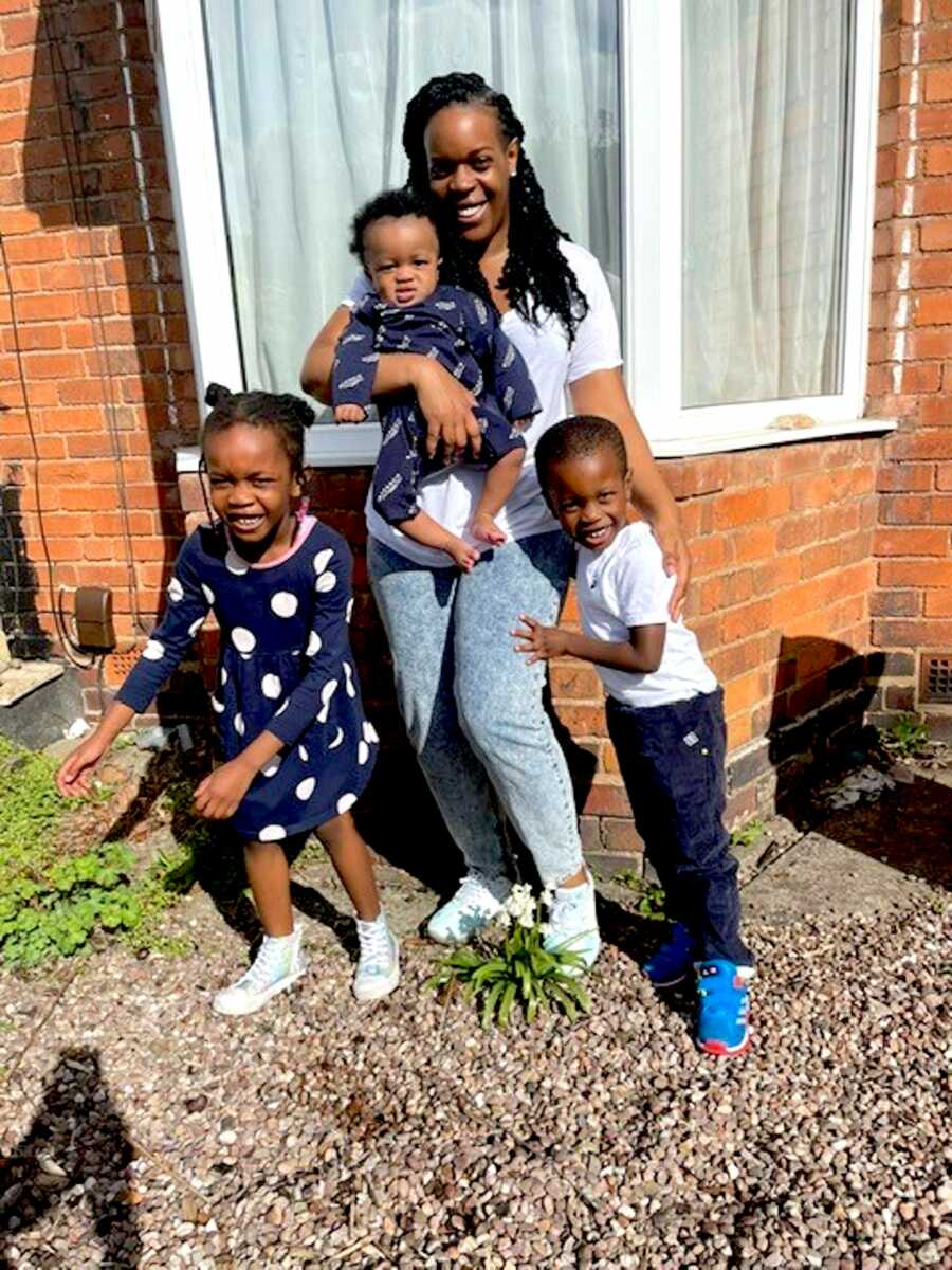 Mom and C-section birth coach takes a photo with her three children