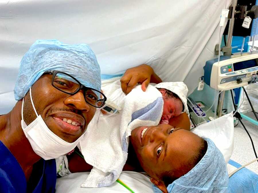 Man takes selfie with his wife after she just gave birth via C-section