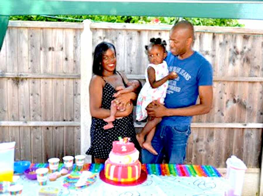 Family take photo together at their daughter's birthday party