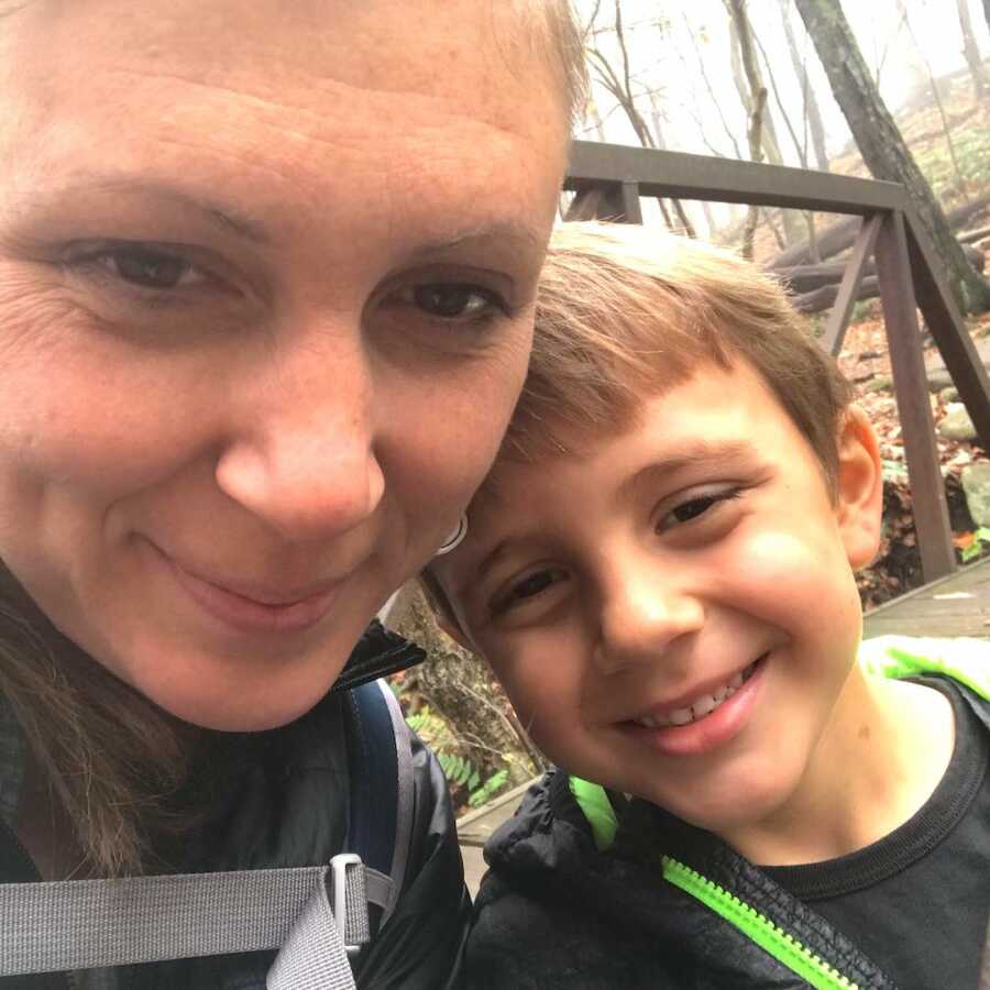 mom and son take a selfie while on a hike