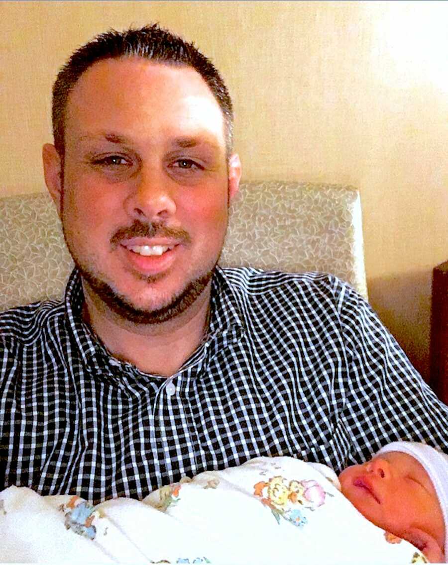 Father takes a selfie with his newborn child
