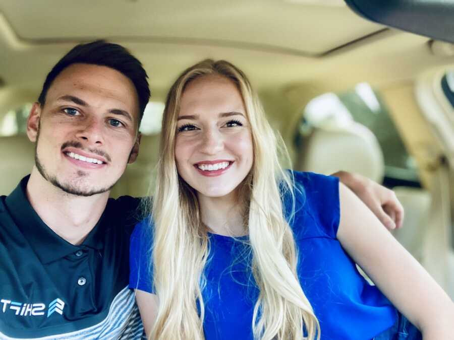 husband and wife take a selfie together in the car