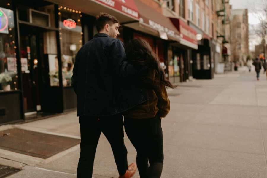 A woman and her partner walking the streets of New York