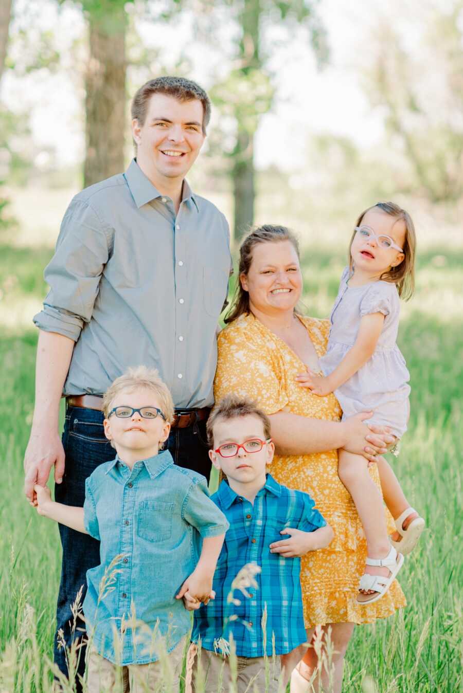 A family with their three autistic children outside