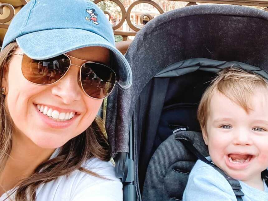 A mom and her toddler son in a stroller out and about