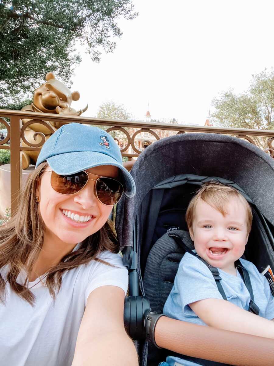 A mom and her toddler son in a stroller out and about