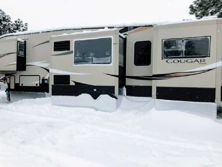 An RV covered in snow