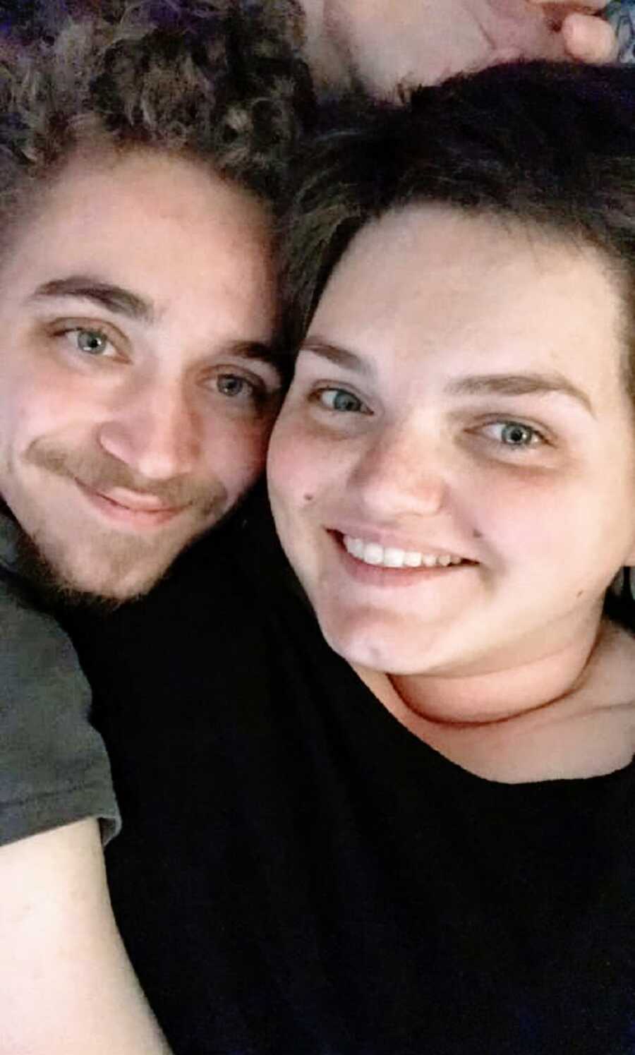 A woman and her partner sitting together