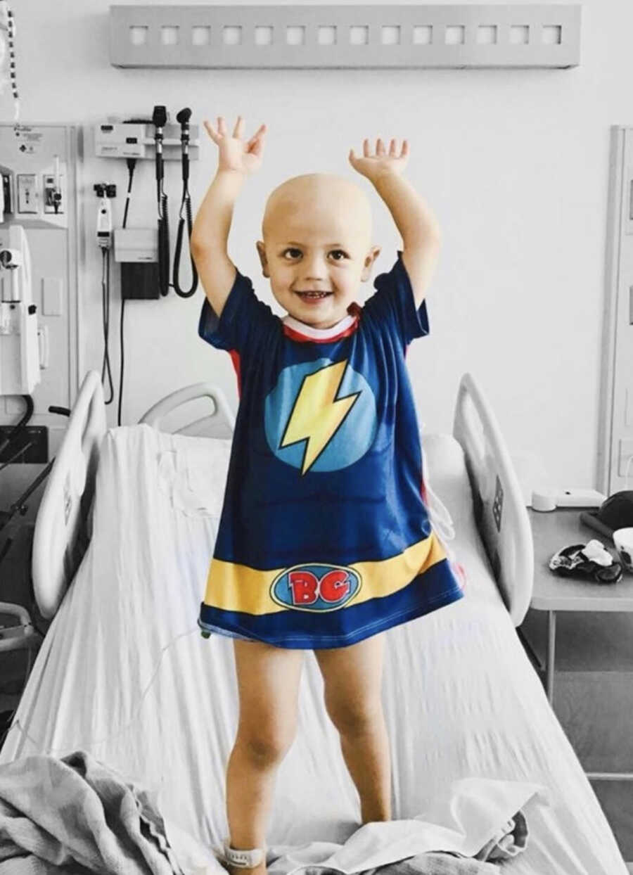 child wearing a brave gown in the hospital