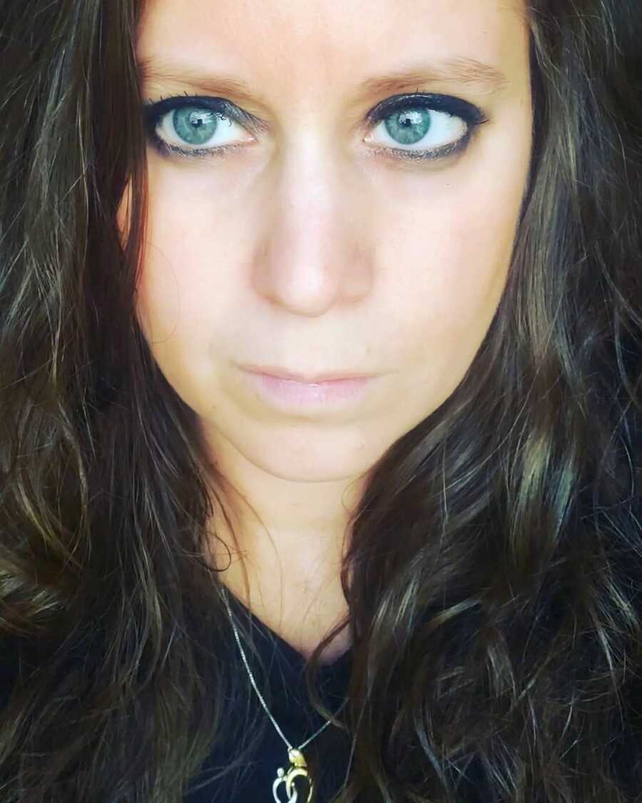 close up selfie of woman with intense blue eyes