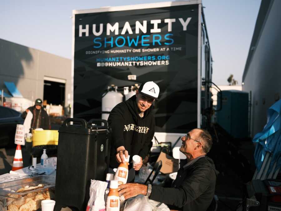 recovered addict seen helping with humanity showers, community service