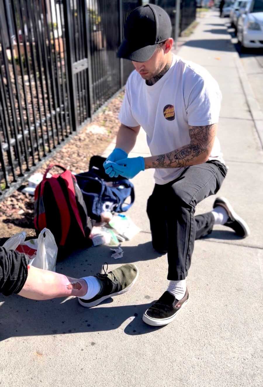 recovering addict helping those in need bandage a wound
