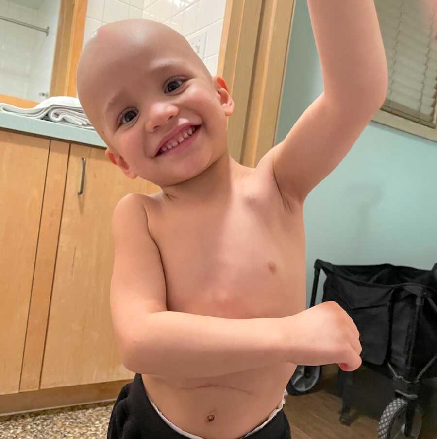 boy with childhood cancer smiles widely