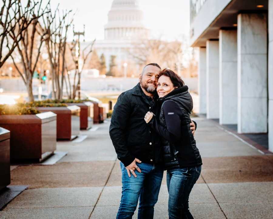 A woman stands with her husband in Washington DC