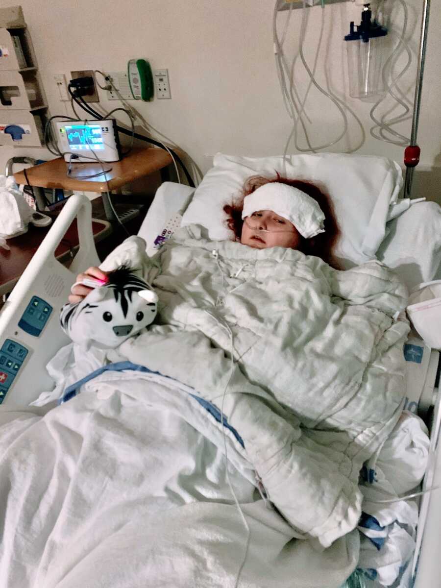 A woman in a hospital bed after an amputation