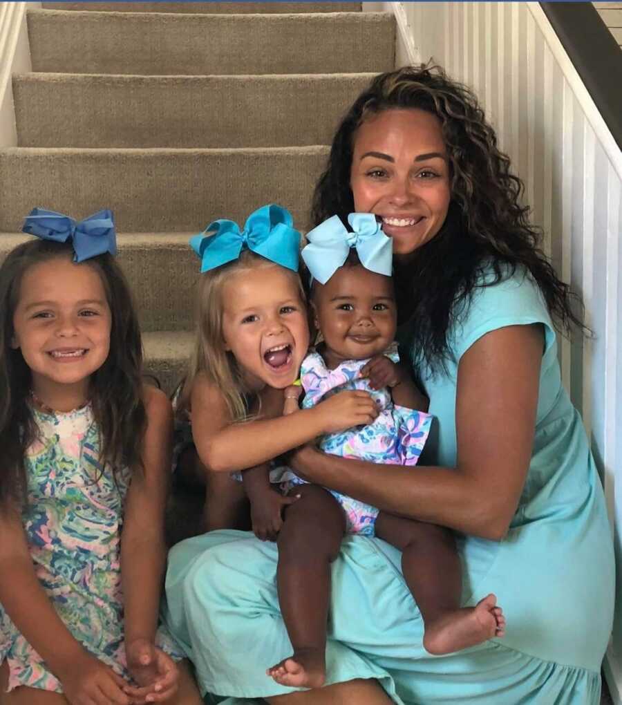 mom with daughters on stairs 