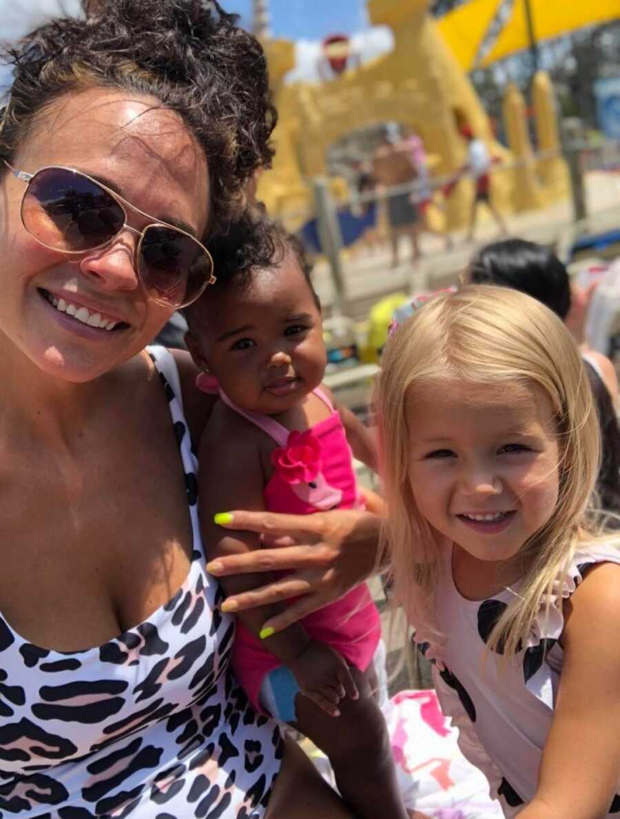 mom with daughters at a pool 