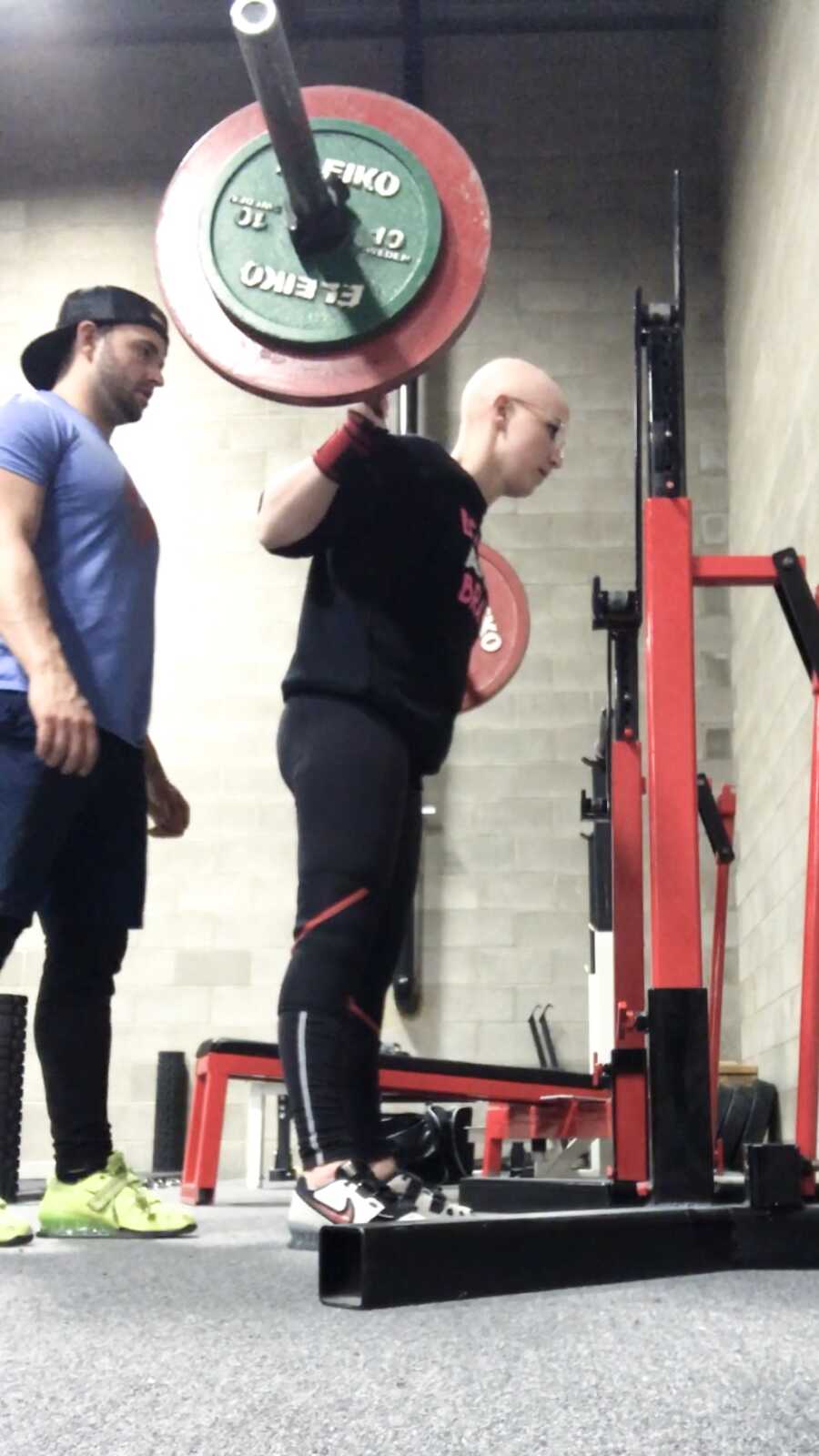 woman lifting weights after cancer